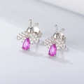 Detailed view of silver bee stud earrings with pink drop stone and zircon wings - 925 Silver / White