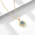 Elegant s925 silver necklace with sky blue topaz pendant and gold snowflake details - 925 Silver / Gold