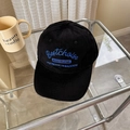 Classic black baseball cap with blue embroidery on a modern glass table setting - 56-58cm Adjustable / Black