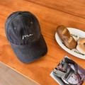 Deep grey washed cotton baseball cap with white me embroidery on wooden background - Gray