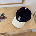 Corduroy baseball cap in navy and cream featuring a cute bear embroidery detail - Navy Blue + Beige