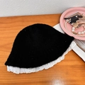 Black plush knit bucket hat with white lace embroidery trim on a wooden background - 56-58cm / Black