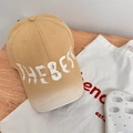 Retro khaki wash baseball cap featuring white THE BEST graffiti lettering on front - 56-59cm Regular / Camel
