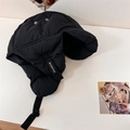 Black quilted trapper hat with earflaps and adjustable strap for winter protection - 56-58cm / Black