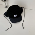 Fleece camo baseball cap in black with earflaps and a stylish drawstring detail - Adult Size / Black