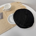 Classic black denim beret with white contrast stitching and a vintage top handle design - Black