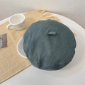 Dark blue denim beret with yellow contrast stitching and retro metal tag - Vintage Blue