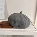 Dark grey wool beret with a gold vintage metal logo and classic small peak style - Size 56-58 / Dark Gray