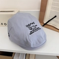 Light gray cotton flat cap featuring black embroidered shark and artistic lettering - 56-58cm (Adjustable) / Light Blue