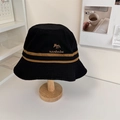 Black cotton bucket hat with brown stripes and fox embroidery in a cozy home setting - 56-58cm / Black