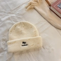 Creamy white distressed knit beanie featuring fox embroidery and ribbed texture - Off-white