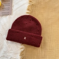 Distressed dark red ribbed knit beanie with white embroidered R letter and ripped detail - 56-59cm / Burgundy