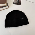 Solid black knitted beanie with a folded cuff and a minimalist logo patch for winter - 56-58cm (Elastic) / Knitted Beanie / Black