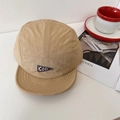 Khaki five-panel camper cap with COOL triangle patch on a modern minimalist desk - 56-58cm / Khaki