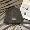 Black ribbed knit beanie featuring a minimalist rectangular letter label for women - 56-62cm / P-Black