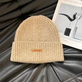 Oatmeal knit beanie with vertical ribs and a small leather brand patch on the cuff - 56-62cm / Light Khaki