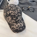 Gray and beige leopard print cotton baseball cap with classic curved brim on a desk - 56-58cm (Adjustable) / Brown