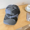 Classic blue camouflage baseball cap in washed cotton twill on a wooden table - 56-58cm Adjustable / Blue