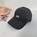 Dark grey cotton baseball cap with white embroidered letter B in a lifestyle setting - 56-58cm Adjustable / Gray