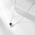 Detail of emerald heart zircon pendant with pear-shaped white stone on silver chain - 925 Silver / White