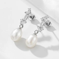 Detail of S925 sterling silver pearl earrings with square zirconia and vintage texture - 925 Silver / White