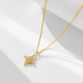 Macro view of gold north star pendant necklace with cubic zirconia on white background - 925 Silver / Gold