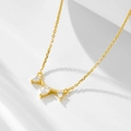 Detail view of gold pear-cut crystal pendant on a delicate chain necklace - 925 Silver / Gold