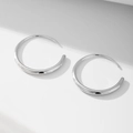 Polished silver geometric hoop earrings with reflective mirror finish on white background - 925 Silver / Silver