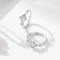 Close-up of S925 silver square zircon earrings with diamond-cut stud details - 925 Silver / White