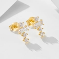 Close-up of gold 925 silver stud earrings with square and round cubic zirconia stones - 925 Silver / Gold