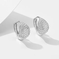 Macro shot of silver S925 sterling silver hoop earrings with pave-set cubic zirconia stones - 925 Silver / Silver