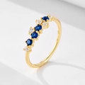 Detail of S925 silver gold ring with blue sapphires and white cubic zirconia stones - Spinel Blue (Gold)