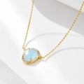 Collana in argento sterling con ciondolo ovale in pietra azzurra e finitura in oro - Argento 925 / Oro