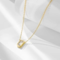 Detailed view of rectangle zircon pendant on gold chain with soft window shadow background - 925 Silver / Gold