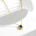 French luxury S925 silver necklace with blue zircon pendant on a white marble pillar - 925 Silver / Gold