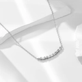 Minimalist S925 silver necklace with baguette cut zircon smile pendant on a stone base - 925 Silver / White