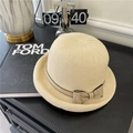 Chic beige knitted bucket hat with a bow detail on a stylish dark table setup - 56-58cm / Beige