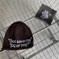 Dark brown knit beanie with white letter embroidery placed in a metal shopping cart - 56-60cm (Elastic) / Coffee