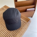 Minimalist black 5-panel camper hat with a short brim on a woven chair surface - 56-59cm (Adjustable) / Black