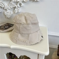 Frayed edge bucket hat in ivory beige featuring a patchwork textured fabric design - 56-58cm / Beige