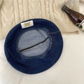 Deep blue denim beret with golden NK metal letter tag on side, flat lay view - 56-58cm / Dark Blue