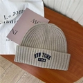 Gray American vintage knit beanie with New York embroidery on a wooden table - 56-65cm (Elastic) / Beige Khaki