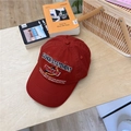 Dark red cotton baseball cap with fashion statement embroidery on a wooden table - 56-58cm / Burgundy