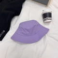 Minimalist purple cotton bucket hat for sun protection in a stylish lifestyle setting - 56-60cm / Purple