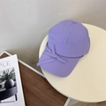 Light purple baseball cap with bow tie decoration on a white table setting - 56-59cm(Adjustable) / Purple