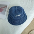 Denim bucket hat with white bow embroidery and vintage washed blue finish - 56-58cm Adjustable / Medium Blue & White