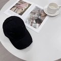 Retro black distressed baseball cap with ripped details and frayed edge on a table - 56-59cm (Adjustable) / Black