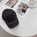 Distressed black cotton baseball cap with ripped details on a minimalist white table - 56-59cm (Adjustable) / Dark Gray