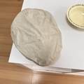 Beige cotton newsboy cap featuring XX white embroidery in a flat lay minimalist display - 56-58cm / Beige