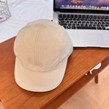 Khaki quick-dry five-panel camper hat shown on a dark wooden table in a lifestyle setting - 56-59cm (Adjustable) / Khaki